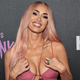 Image for article titled Megan Fox Reads Witchcraft Book (Sans Engagement Ring) Amid Split Rumors